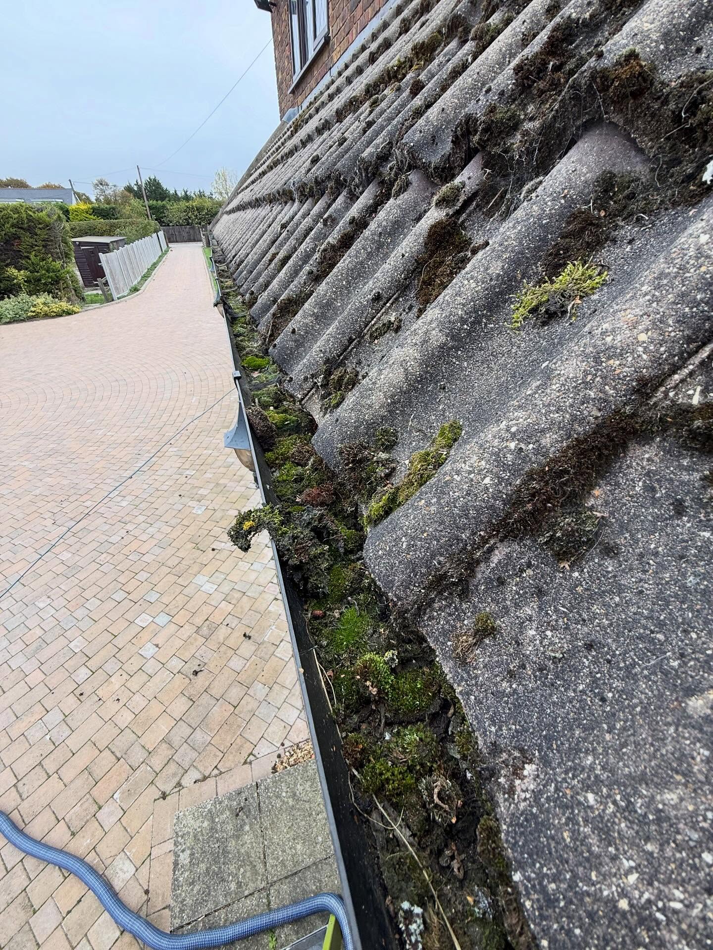 Blocked gutter before clearing in Oundle